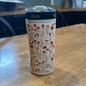 Cream and Red Thermos with Botanical Design